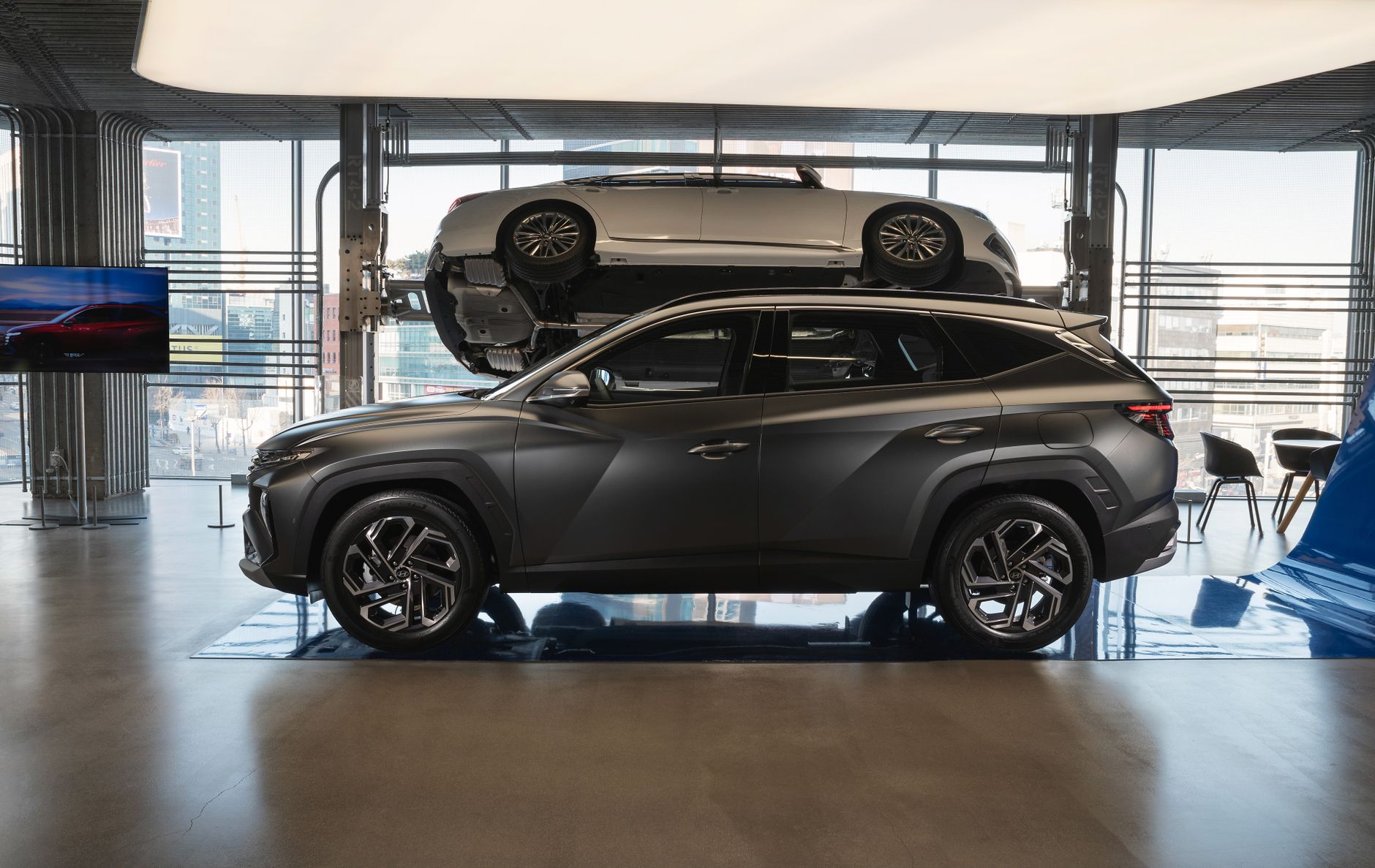 Sleek gray Hyundai Tucson showcased in a contemporary studio with natural lighting.