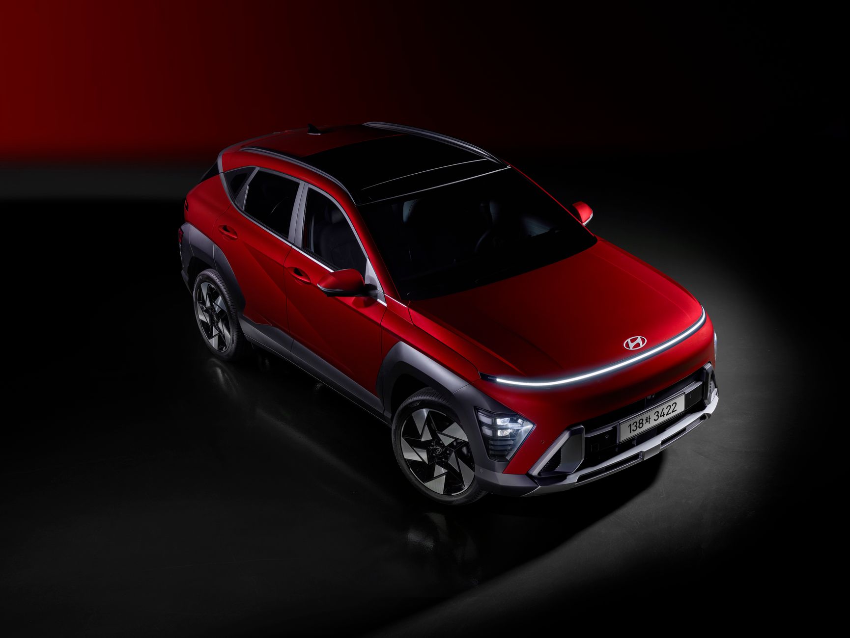 A striking red SUV with contemporary design elements and dynamic lighting, emphasizing modern automotive innovation.
