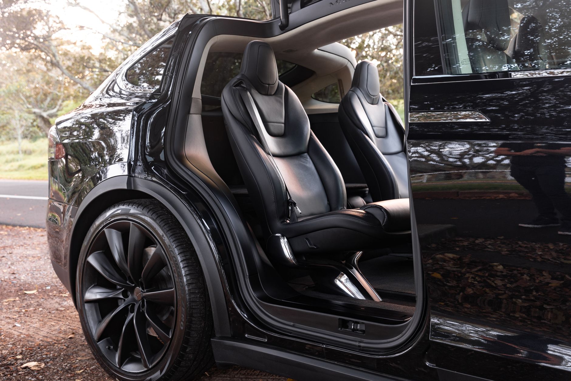 Sleek Tesla Model X with open door showcasing luxury interior in Sydney.