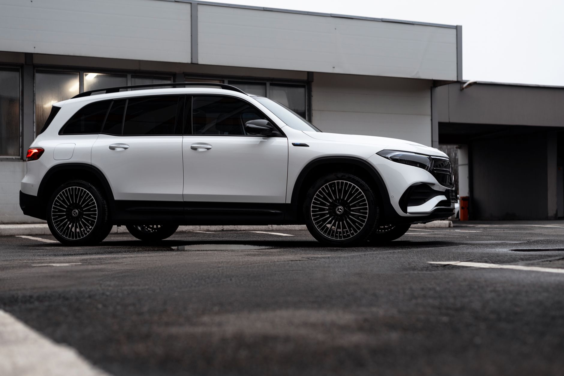 Modern white Mercedes-Benz EQB SUV parked outdoors showcasing luxury and style.