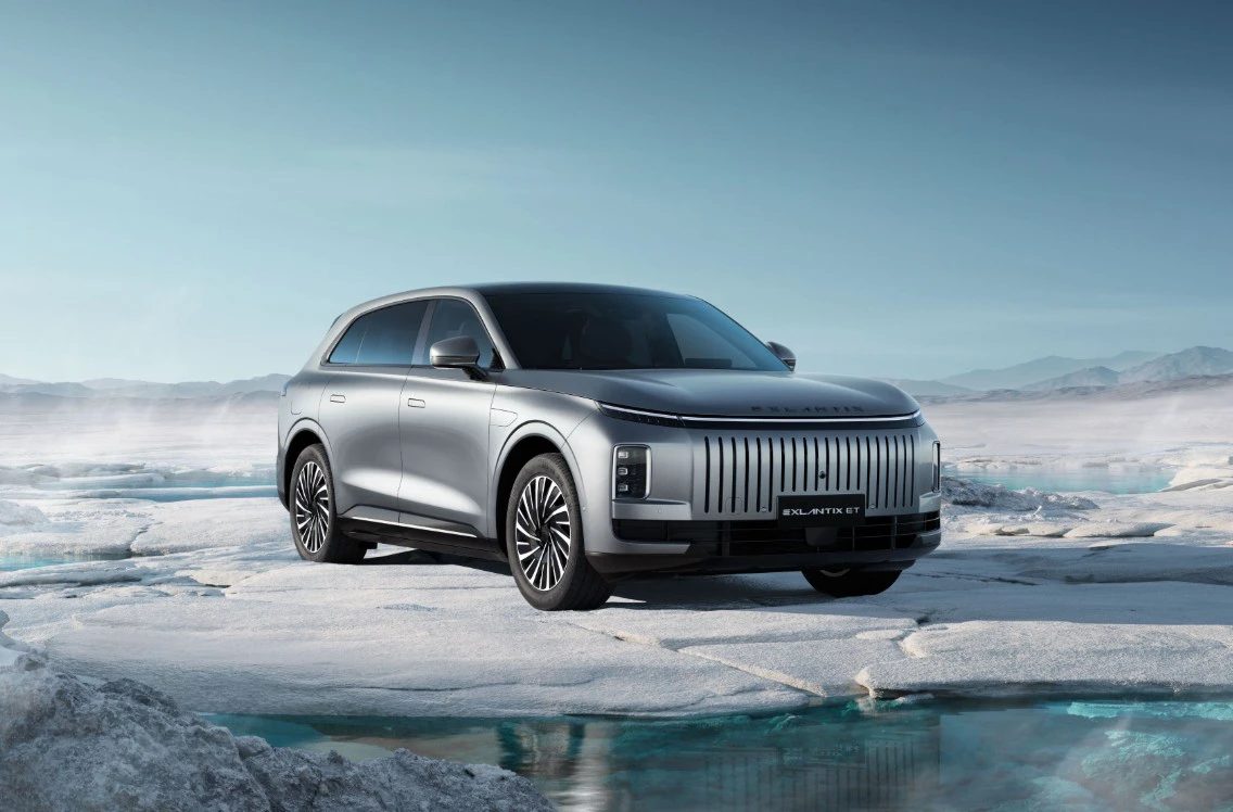 Electric SUV with trunk open in a serene forest setting, ideal for travel and exploration concepts.