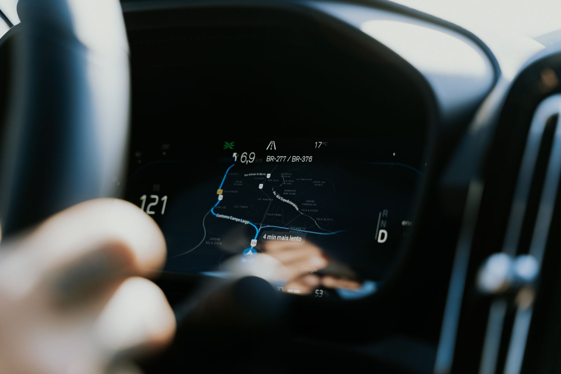 Close-up view of a car dashboard showing a GPS navigation screen in use.