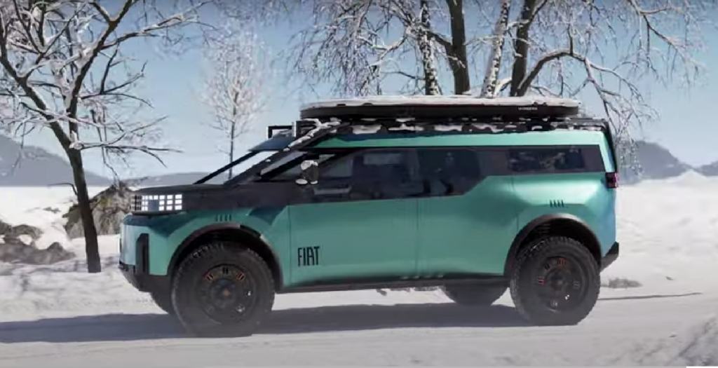 FIAT kamper w zimowym krajobrazie z widocznymi oponami terenowymi.